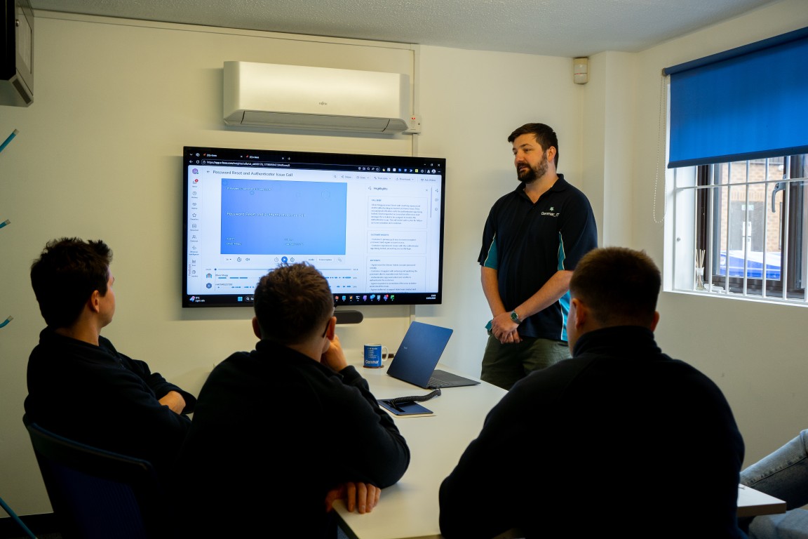 Genmar IT team discussion in conference room